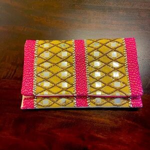Pink and gold clutch